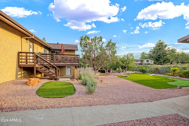 view of yard featuring a wooden deck