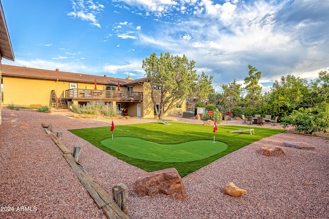 exterior space with a deck and a patio