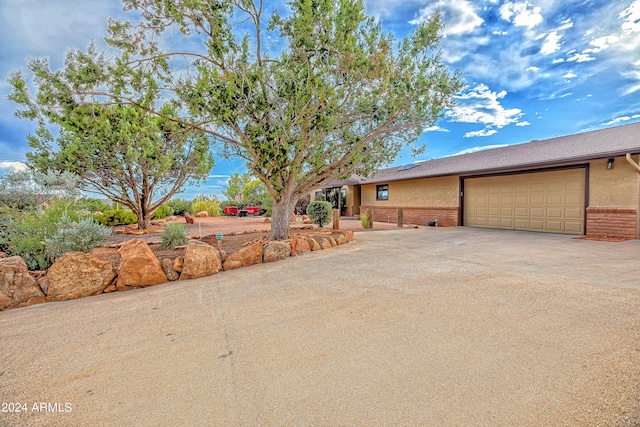 view of property exterior featuring a garage