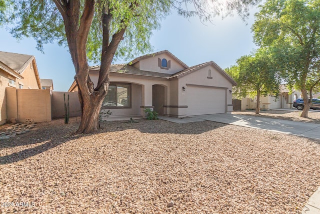 view of front of property with a garage