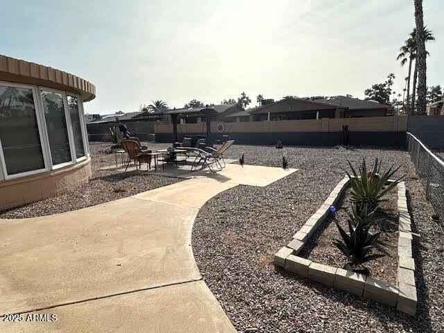 view of yard with a patio area and a fire pit