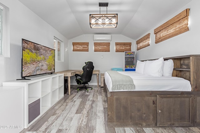 unfurnished bedroom with a wall mounted AC, vaulted ceiling, wood-type flooring, and built in desk