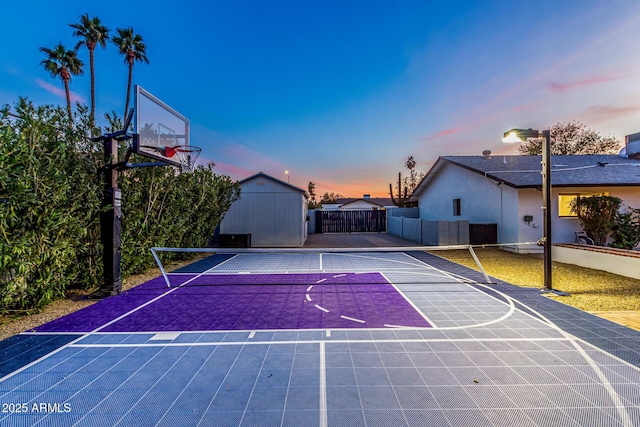 view of basketball court featuring tennis court