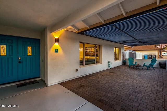 view of patio with a fire pit