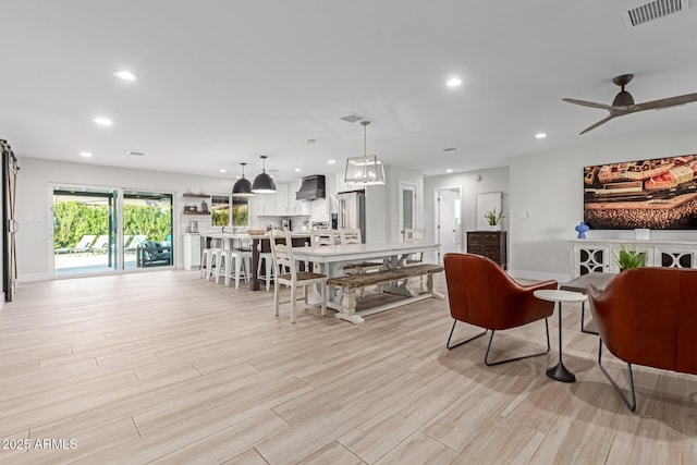 interior space featuring ceiling fan and light hardwood / wood-style flooring