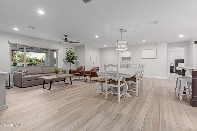 dining room featuring ceiling fan and light wood-type flooring