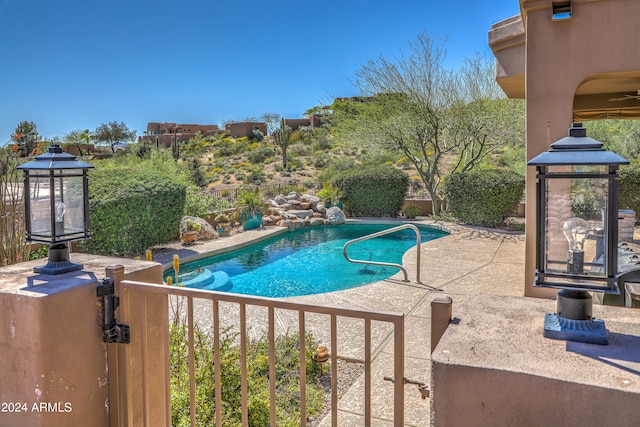 view of swimming pool with a gazebo and a patio