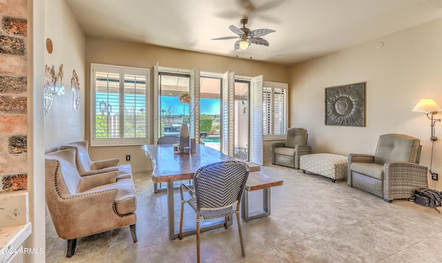 interior space featuring ceiling fan and light tile floors