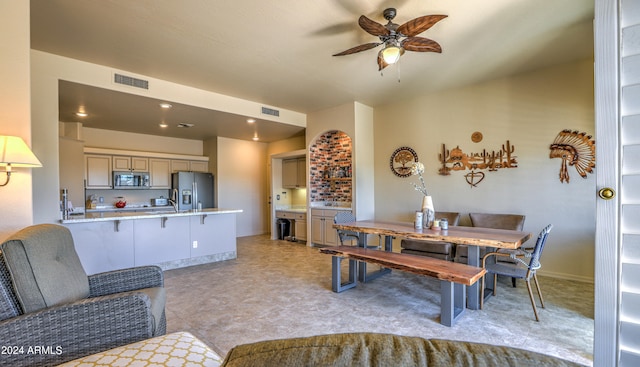 living room with ceiling fan and light tile floors