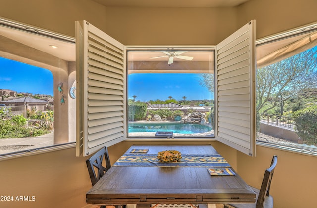 unfurnished dining area with ceiling fan and a healthy amount of sunlight