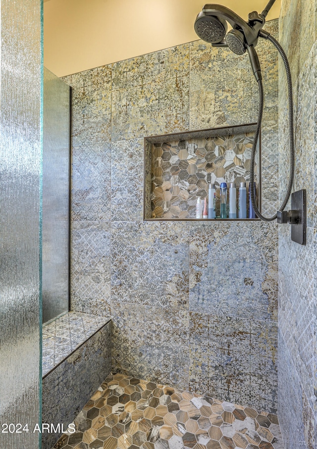 bathroom featuring a tile shower