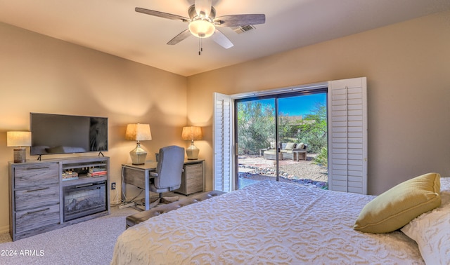 carpeted bedroom with ceiling fan and access to exterior