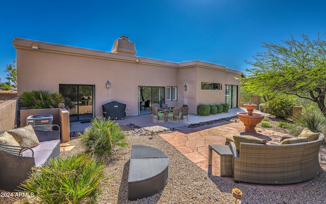 rear view of house featuring a patio area