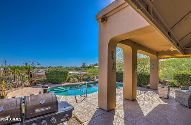 view of swimming pool with a patio area