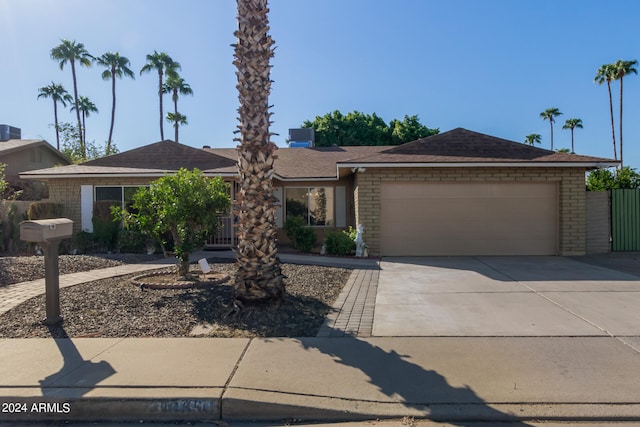 ranch-style home with a garage