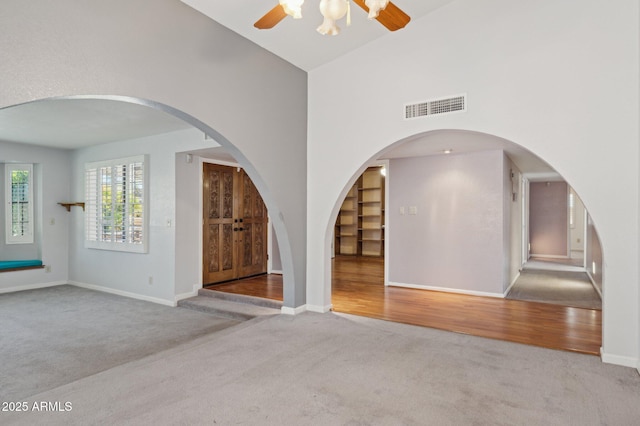 2053 W Natal Cir, Mesa, AZ 85202 - unfurnished room featuring carpet floors, a ceiling fan, and a towering ceiling