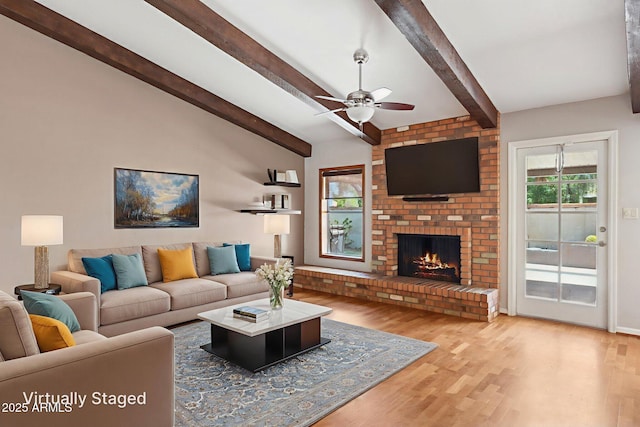 2053 W Natal Cir, Mesa, AZ 85202 - living area with wood finished floors, a ceiling fan, and a fireplace