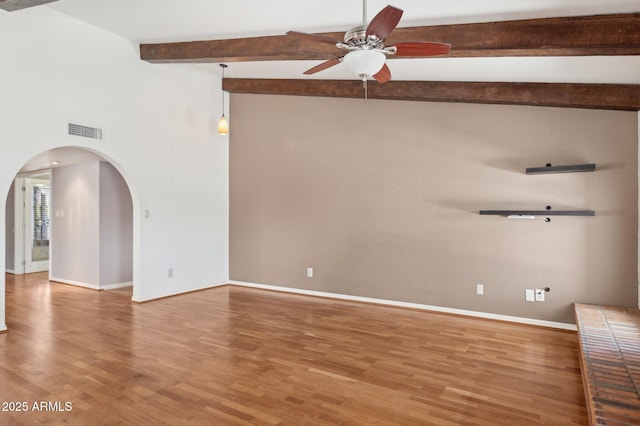 2053 W Natal Cir, Mesa, AZ 85202 - unfurnished room with ceiling fan, beam ceiling, arched walkways, and light wood-style floors