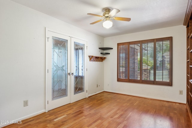 2053 W Natal Cir, Mesa, AZ 85202 - empty room featuring french doors, ceiling fan, and wood finished floors