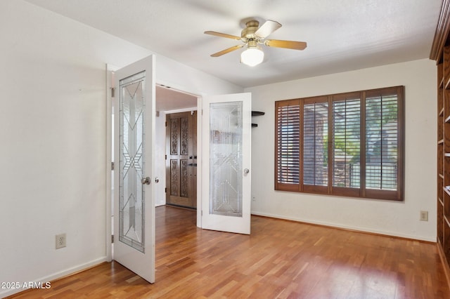 2053 W Natal Cir, Mesa, AZ 85202 - empty room with light wood-style flooring and ceiling fan