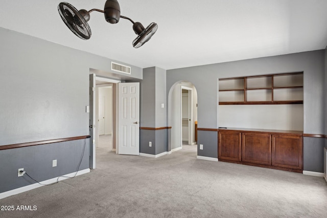 2053 W Natal Cir, Mesa, AZ 85202 - carpeted spare room featuring arched walkways and baseboards