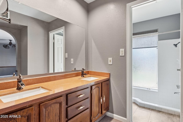 2053 W Natal Cir, Mesa, AZ 85202 - bathroom with double vanity, a shower, a textured wall, and tile patterned floors