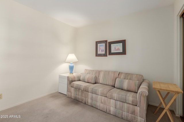 living room featuring light carpet and baseboards