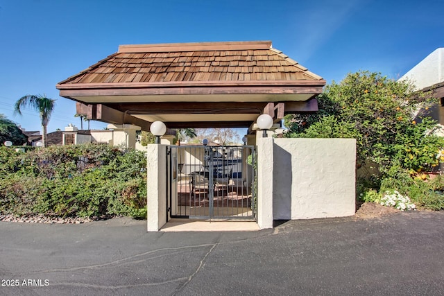 view of community featuring a gate and fence