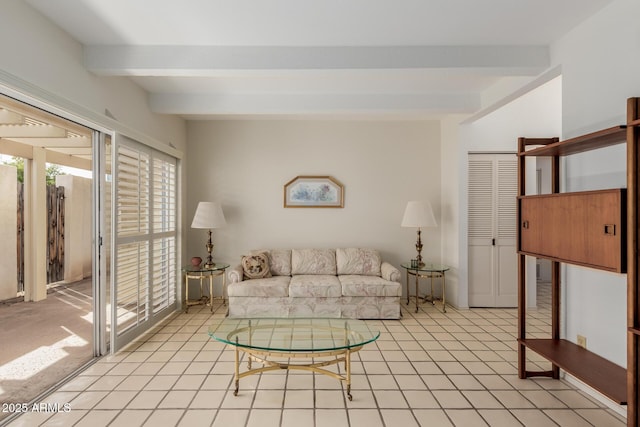 living area with light tile patterned flooring and beamed ceiling