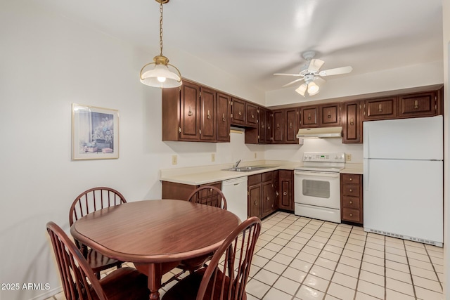 kitchen featuring light countertops, hanging light fixtures, ceiling fan, white appliances, and under cabinet range hood