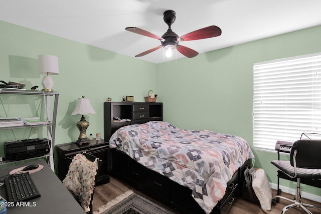 bedroom featuring wood-type flooring and ceiling fan