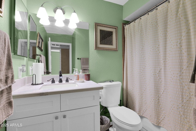 full bathroom featuring shower / bathtub combination with curtain, vanity, and toilet