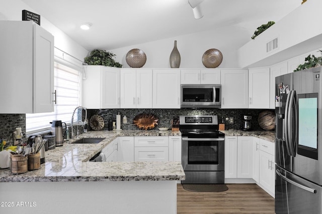 kitchen featuring white cabinetry and appliances with stainless steel finishes