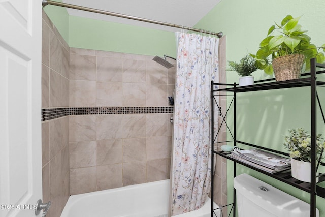 bathroom with shower / bathtub combination with curtain and toilet