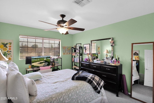 carpeted bedroom featuring ceiling fan