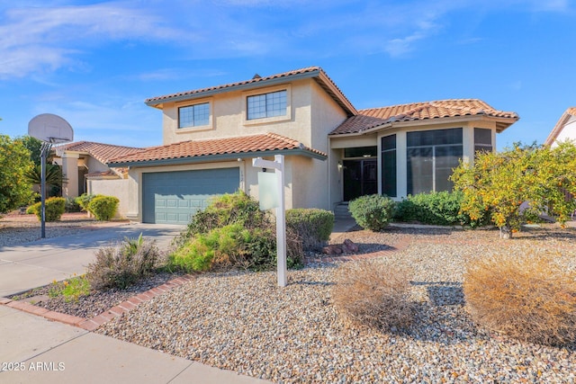 mediterranean / spanish-style house featuring a garage