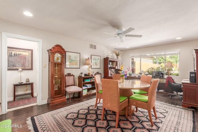 dining area featuring ceiling fan and dark hardwood / wood-style floors