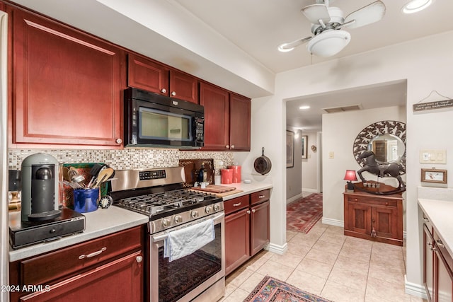 kitchen featuring backsplash, dark brown cabinets, light countertops, black microwave, and gas stove