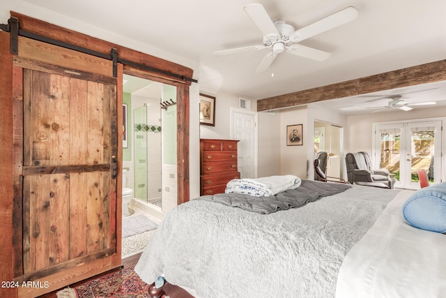 bedroom with a barn door, access to outside, french doors, and ceiling fan
