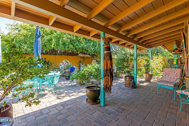 view of patio with a fenced backyard and outdoor dining area