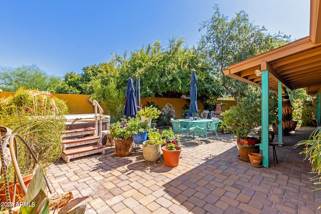 view of patio with a hot tub