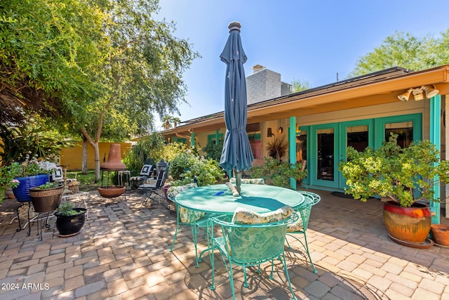 view of patio featuring outdoor dining space and french doors