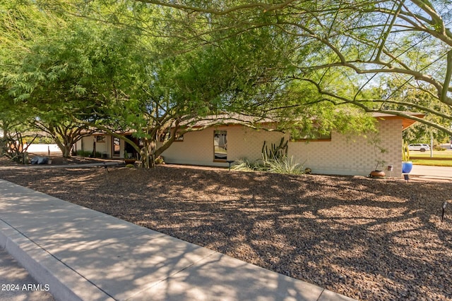 view of front of property with concrete block siding