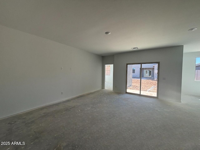 unfurnished room featuring visible vents