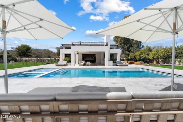 view of pool featuring ceiling fan, a patio, and a fenced in pool