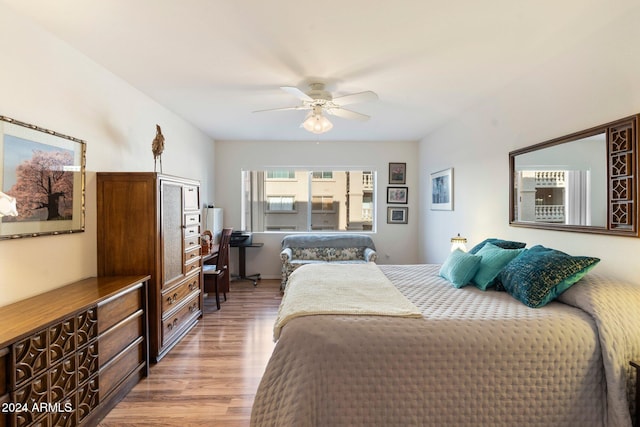 bedroom featuring hardwood / wood-style flooring and ceiling fan