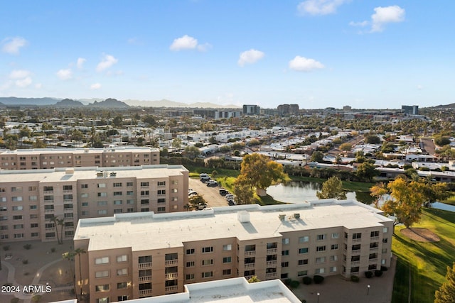 birds eye view of property featuring a water and mountain view