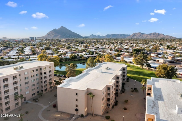 birds eye view of property featuring a water and mountain view