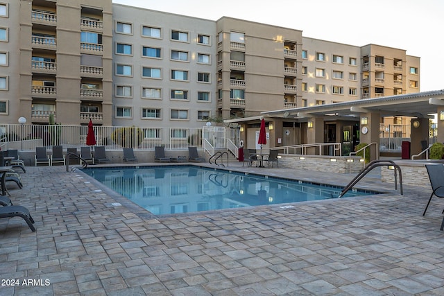 view of swimming pool featuring a patio area