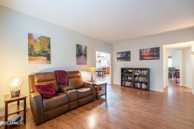 living room featuring baseboards and wood finished floors